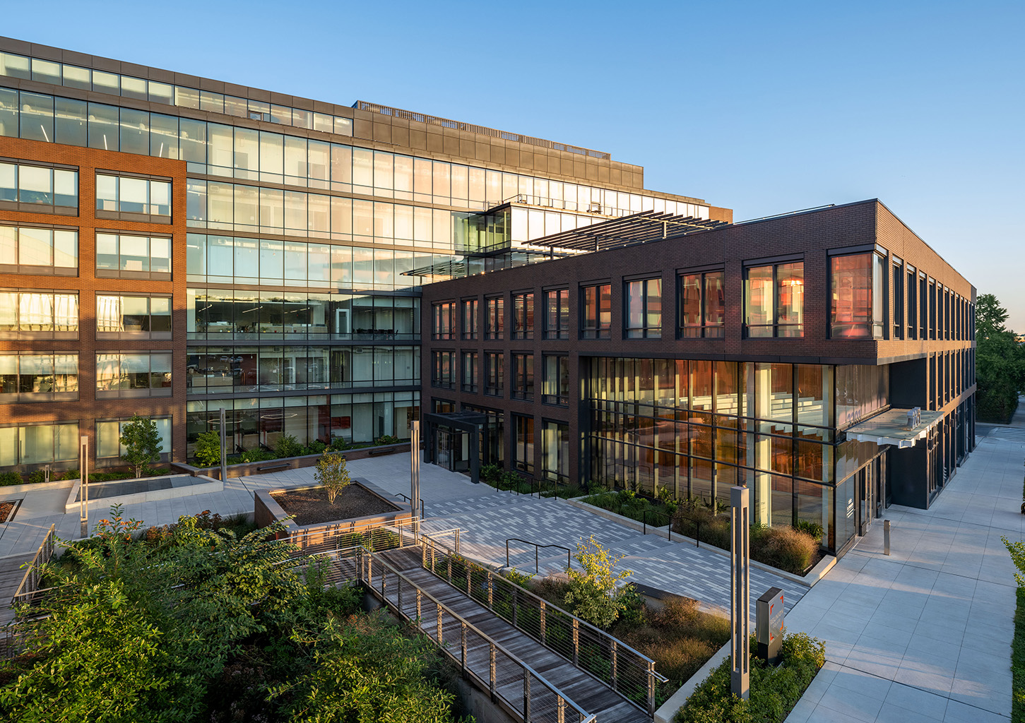 Modern buildings with landscaped courtyard.