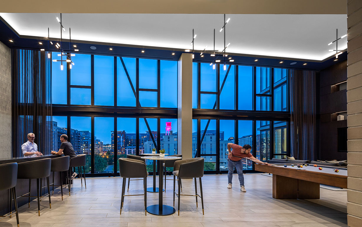 Modern lounge with pool table and city view