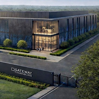 Modern building with landscaped entrance.